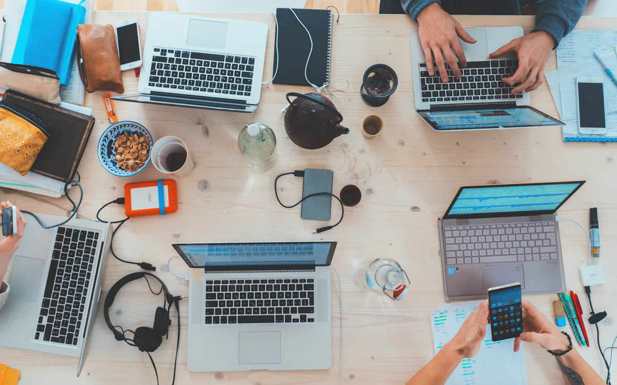 Laptops and digital devices used in a software development workspace